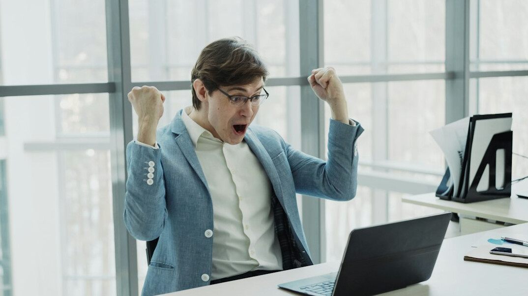 person celebrating coding milestone