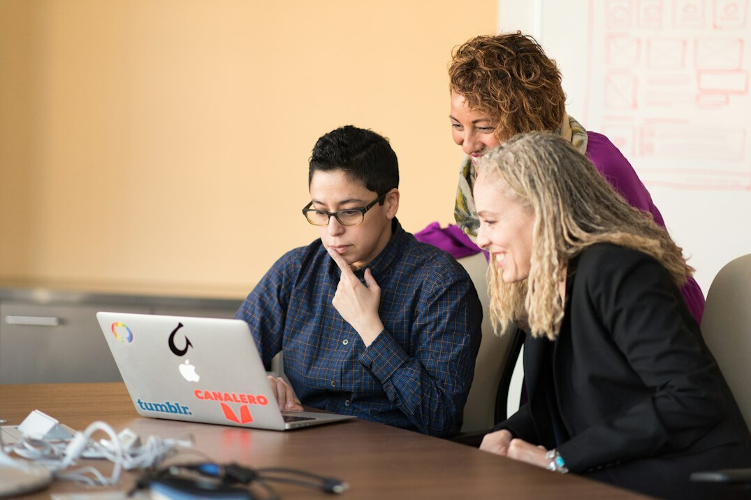 diverse team discussing code